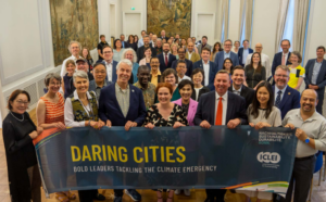 Members of ICLEI and the City of Bonn hold a banner promoting Daring Cities